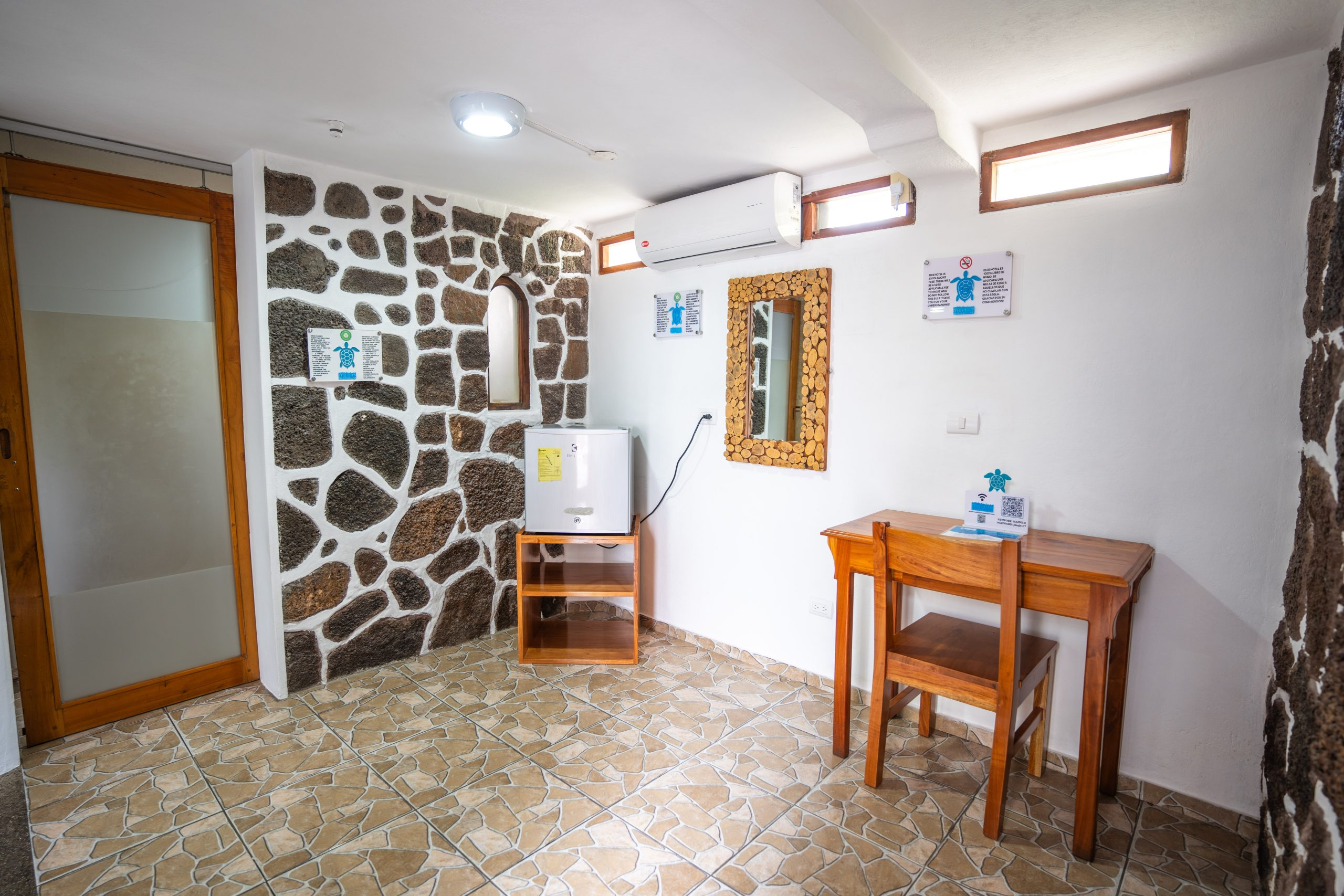 Albatros Room — warm interiors with Galápagos art